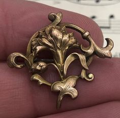 "Antique French Art Nouveau Gold-filled Brooch Flower c1900. It's in good condition. Size: 1\" 1/8 x 1\" The last photo shows a few Art Nouveau brooches, don't forget to take a look at them! We import French antiques and have a boutique in Seattle called The Curious Nest. For items over $100 we automatically insure the package (even if it's at our own cost). A sales tax will be applied for buyers living in Washington state. Please email us with any questions that you may have and we promise a qu Antique Collectible Brooch Lapel Pin, Antique Collectible Lapel Pin Brooch, Collectible Antique Brooch Lapel Pin, Fleurs Art Nouveau, Living In Washington State, French Art Nouveau, Brooch Flower, Carved Shell, Sales Tax