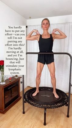 a woman standing on top of a trampoline