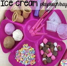 an ice cream tray filled with lots of different types of candy and candies on it