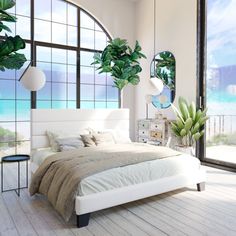 a bedroom with large windows and a bed in front of the window that has potted plants on it