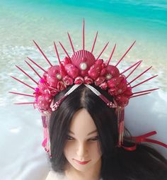 Hot pink mermaid crown for adult is absolutely lovely and would be lovely for a photoshoot, beach wedding, or mermaid costume adult, burning man clothing for women, mermaid festival crown, siren cosplay or mermaid cosplay. This Siren headpiece will be an excellent complement to mermaid party outfit for women. DIMENSIONS: - This Seashell crown is suitable for adults. - The height of the spiked is about 5.6 inches (13 cm). - The spikes are made with wood. The spikes are painted with hot pink acrylic paint. - The crown is decorated with rhinestone, beads and natural shells. - The crown on the head can be secured with a ribbon. - This crown is beaded and decorated with strings of beads that I collected by hand. - This crown is unique, made in one instance. 100% repetition is not possible. Only Pink Carnival Headpieces, Adjustable Pink Headpiece For Costume Party, Whimsical Pink Crown Headpiece, Pink Beach Headband Hair Accessory, Pink Beach Headband, Pink Headband For Beach, Pink Structured Crown Headpiece For Summer, Bohemian Crown For Festival With Structured Shape, Whimsical Pink Costume Hat Headband