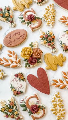 decorated cookies are arranged on a table