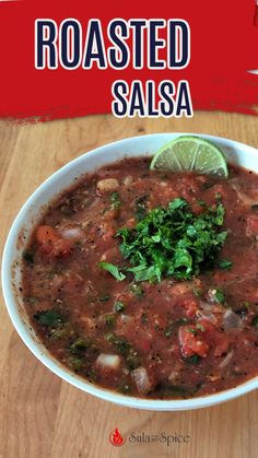 a white bowl filled with salsa and garnished with cilantro on top