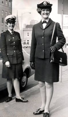 two women in uniform standing next to each other