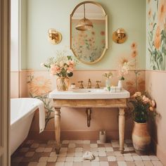 the bathroom is decorated in pastel colors with flowers on the wall and antique fixtures