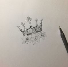 a pencil drawing of a crown with flowers