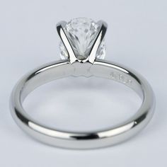 a white gold engagement ring with a princess cut diamond