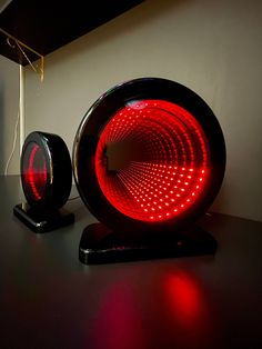 a red light sitting on top of a black table