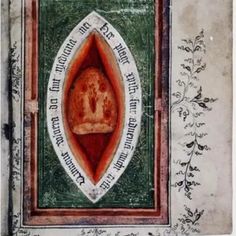 an old book with a painting on the cover and writing in red, white and green