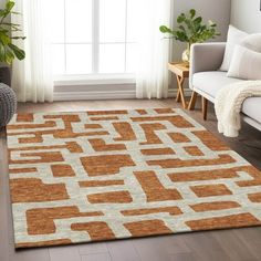 an orange and white rug in a living room