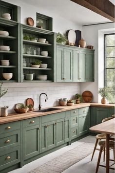 Nature-inspired kitchen with green cabinets and large window Sage Green Cabinets Wood Counter, Green Kitchen Cabinets Copper Backsplash, Forest Green And White Kitchen, Green Timber Kitchen, Earth Tone Decorating, Bold Color Kitchen, Apartment Kitchen Color Schemes, Green Cabinets With Brown Granite, Colorful Kitchen Cabinet Ideas