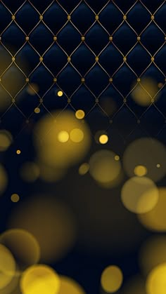 an image of some lights that are shining on the dark night time scene with gold and blue colors