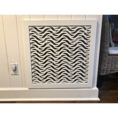 a white cabinet with wavy design on it