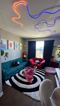 a living room filled with lots of furniture and colorful lights on the ceiling above it