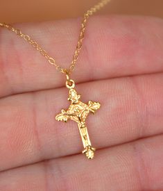 "This is a 14Krose gold filled crucifix cross charm necklace.  This is a beautiful ornate crucifix cross in 18kt rose gold filled, measures 20x12mm and comes on a 14kt rose gold filled shiny cable chain with spring clasp.  Choose length of 16\", 18\", 20\" or 22\".  Comes in a cute gift box ready to present.  STERLING SILVER VERSION NOT SHOWN. *Model is wearing a 16\" length in the photo. GOLD IN PHOTO IS OUT OF STOCK AND WILL NOT BE RETOCKED. ONLY ROSE GOLD AND STERLING SILVER LEFT." Rose Gold Crucifix Necklace As Gift, Gift Rose Gold Crucifix Cross Necklace, Rose Gold Crucifix Jewelry For Gifts, Rose Gold Cross Necklace As A Gift, Dainty Rose Gold Crucifix Necklace, Dainty Rose Gold Crucifix Jewelry, Catholic Jewelry Necklace, Scapular Necklace, 14kt Gold Jewelry