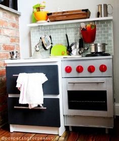 a kitchen with an oven, stove and shelves