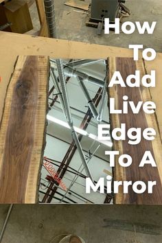 a mirror sitting on top of a piece of wood next to a box with the words how to add live edge to a mirror