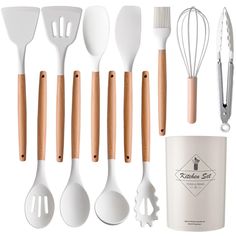 the kitchen utensils are lined up next to each other with wooden handles and spoons