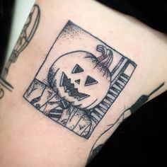 a black and white photo of a jack - o'- lantern tattoo