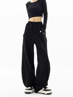 Embrace a touch of sophistication with our High-Waisted Wide-Leg Paneled Joggers, blending casual comfort with a polished finish.
  Crafted from 100% modified polypropylene fiber, these joggers offer a soft knit texture and a structured wide-leg silhouette. The high waist design is both flattering and practical, lending itself to a variety of versatile styling options.
  Perfect for an understated office look or a relaxed weekend outfit, pair these joggers with a fitted turtleneck and ankle boot Solid High-stretch Bottoms With Pockets, Black High Waist Bottoms With Comfort Waistband, High Waist Black Bottoms With Comfort Waistband, High Stretch Solid Bottoms With Pockets, Chic Fitted Solid Sweatpants, High Stretch Bottoms For Spring Streetwear, High Stretch Solid Color Bottoms With Pockets, Chic Fitted Sweatpants, High Stretch Spring Streetwear Bottoms