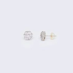 These 14K CZ Cluster Flower Stud Earrings are a stunning addition to any jewelry collection. Made with high-quality 14K white gold, these earrings are both durable and elegant. The intricate cluster flower design is adorned with sparkling cubic zirconia stones, adding a touch of glamour to any outfit. These earrings are perfect for any occasion, whether it's a formal event or a casual day out. The 14K CZ Cluster Flower Stud Earrings are a must-have for anyone who loves classic and timeless jewel Cubic Zirconia Bracelet, Cubic Zirconia Necklace, Flower Stud Earrings, Cubic Zirconia Earrings, Flower Stud, Cubic Zirconia Rings, Cz Earrings, Zirconia Earrings, Women Diamond