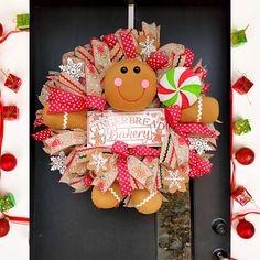 a christmas wreath with a gingerbread and candy cane on the front door for someone's house