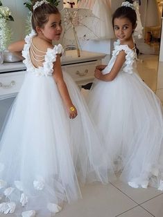 Cute Tulle Appliques Backless Flower Girl Dresses with Pearls White Sleeveless Ball Gown For Bridesmaid, White Sleeveless Bridesmaid Ball Gown, Spring White Bridesmaid Ball Gown, White Bridesmaid Ball Gown For Spring, White Sleeveless Tulle Gown, White Spring Princess Dress For Bridesmaid, White Princess Dress For Bridesmaid, White Spring Wedding Ball Gown, White Sleeveless Ball Gown For Spring