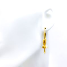 These exquisite 22k gold Bali earrings, weighing 8.7 grams, feature a radiant yellow gold finish and a classic hoop design. Each earring measures 1 inch in diameter and 1.75 inches in length, offering a perfect blend of elegance and sophistication. Ideal for those who appreciate timeless and refined jewelry, these Bali earrings combine the enduring beauty of gold with a graceful hoop style, making them a perfect choice for any special occasion or stylish everyday wear Product Details Gold Purity(karat): 22k Gold Weight(grams): 8.7 Item Finish: Yellow Gold Earring Style: Bali/Hoop Earring Earring Diameter: 1" Earring Length: 1.75" Bali Earrings Gold, Punjabi Bali Earrings Gold, Traditional 22k Yellow Gold Earrings, Festival 22k Gold Yellow Earrings, Yellow 22k Gold Dangle Earrings, Bridal Jewelry Necklace, Precious Stones Rings, Bali Earrings, Diamond Pendant Sets