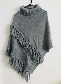 Steve Madden Women's Cable Knit Poncho Heather Grey One Size NWT You wear over a sweater Gray Knitted Sweater One Size, Gray Knitted One-size Sweater, One-size Knitted Gray Sweater, One Size Gray Knitted Sweater, Cozy One Size Gray Sweater, Cozy One-size Gray Sweater, Casual Knitted Shawl Poncho, Casual Knitted Poncho Shawl, Casual Shawl Knit Sweater