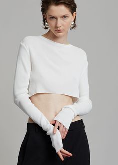 Color: WhiteLightweight ribbed knit with stretch Cropped profileSlim fitCrew necklineLong sleevesInvisible stitched hemUnlined85% Rayon 15% PolyesterDry CleanImported Cropped Knit Top, Invisible Stitch, Knit Crop Top, Knit Top, Ribbed Knit, Knitting, White, Color