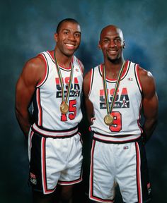 two men standing next to each other with medals on their shoulders and chestes in front of them