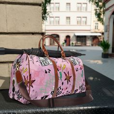 "This travel bag is the perfect mix of pizzazz and practicality. It's crafted from fancy waterproof material, with pockets aplenty, a sturdy handle, and adjustable strap, it's the ideal partner in crime for all your wild escapades! Find more here: https://etsy.me/3Rna07B .: 100% high-grade PU leather .: One size: 20\" × 12'' × 9\" (50.8cm × 30.5cm × 23cm ) .: Brown PU leather handles and an adjustable shoulder strap .: Polyester lining .: Gold-colored zipper  .: All-over print - Items are made to order; Also note that some items might ship separately - Allow 3-7 days order processing before shipping. - Shipping times vary according to your location." Trendy Waterproof Pink Bag, Trendy Pink Luggage For Travel, Trendy Pink Travel Luggage, Trendy Pink Rectangular Luggage, Trendy Travel Bag With Luggage Sleeve For School, Trendy Travel Bag For Weekend Trips, Trendy School Travel Bag With Luggage Sleeve, Trendy Shoulder Bag For Travel, Trendy Waterproof Travel Bags