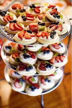 three tiered trays filled with different types of pastries