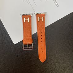 Luxurious Lychee Pattern Leather: The Herms Apple Watch strap is made from genuine lychee pattern leather, offering a unique texture and a premium feel. The high-quality leather ensures durability and a refined look. Iconic Herms H Logo: Featuring the iconic Herms H logo, the strap showcases the brand's signature elegance and prestige. This subtle branding adds a touch of luxury and sophistication to your Apple Watch. Elegant and Timeless Design: The strap's design is both elegant and timeless, making it suitable for any occasion, from casual to formal. Its classic style complements the sleek design of the Apple Watch. Adjustable and Comfortable Fit: Designed with multiple adjustment holes, the strap offers a customizable fit for various wrist sizes. The genuine leather provides a comforta Hermes Apple Watch, Louis Vuitton New, Apple Watch Leather Strap, Best Apple Watch, Buy Louis Vuitton, Luxury Phone Case, Apple Watch Models, Apple Watch Bands Leather, Apple Iphone Case