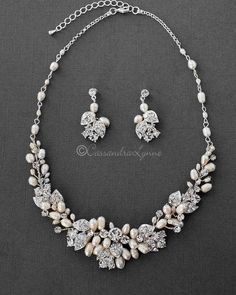 a necklace and earring set with pearls