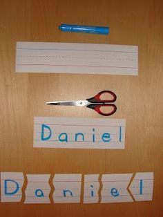 a pair of scissors sitting on top of a piece of paper next to cut out words