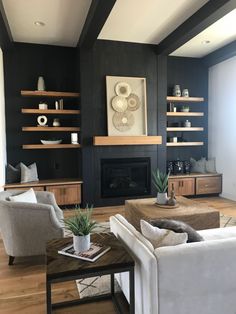 a living room filled with furniture and a fire place next to a wall mounted tv