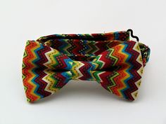 "Mens pre-tied Cinco De Mayo bow tie. Features a Mexican pattern with colors of red, green, orange, blue and yellow.  Pocket Square available upon request pending available of fabric. Cost is $10.99 Convo me to check availability. Pre-tied expertly hand-made from 100% cotton Bow Measures Approximately 4\"x 2.25\". You can select your length from (Boy's 11\" - 16\"), (Men's 14\" - 18\"), (Extra-long 16\" - 22\"). Custom sizes available upon request. Ships within 2 business days. Made in the USA. CUSTOM ORDERS We love custom orders, so you can also go to www.Fabric.com to select from one of their thousands of cotton fabrics and we can make a tie or bow tie for you. These requests will take at least 2 weeks to fulfill. Any Questions about this tie, custom orders or bulk quantities, simply hit Fitted Multicolor Bow Tie For Gift, Multicolor Bow Tie For Gift, Multicolor Bow Tie For Summer Gift, Yellow Pocket Square, Mexican Pattern, Make A Tie, Long Bow, Tie Men's, Mens Bow Ties