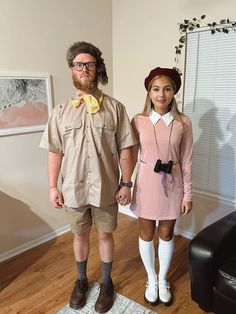 the man and woman are dressed up in costumes for an adult role play party,