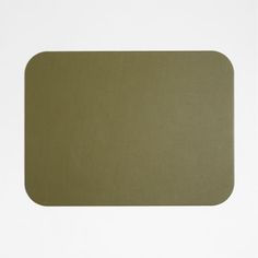 an empty green place mat on a white background