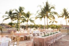 an outdoor wedding setup with tables and chairs