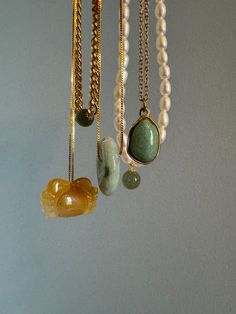 This dainty gemstone necklace with a pop of light green color features a skinny adjustable chain plated with gold and an aventurine pendant. It will be your new everyday necklace no matter the outfit.

Natural aventurine. Made by handwork of carving and polishing. Because of the gemstone’s natural characteristics, each piece may vary slightly in colors and textures. Handmade Gold Amazonite Necklaces, Handmade Gold Amazonite Necklace, Gold Minimalist Charm Necklaces With Natural Stones, Minimalist Gold Charm Necklaces With Natural Stones, Everyday Gold Charm Necklaces With Natural Stones, Minimalist Gold Charm Necklace With Natural Stones, Nature-inspired Jade Pendant Necklace, Gold Jade Necklace With Gemstone Beads, Gold Jade Pendant Necklace