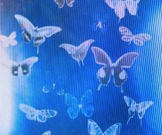 there are many butterflies flying in the air on this tv screen and it looks like they're from another era