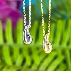 Showcase you love of water with our stunning and modern Wai Raindrop pendant. Water is life in Hawaii and this beautifully designed pendant is sure to add elegance and sophistication to any outfit. .925 Sterling Silver Approx. 1/2" Tall Available in 14K Gold Plated or Silver Includes 18" Adjustable chain w/1" extension Anniversary Drop Jewelry With Polished Finish, Teardrop Shaped Jewelry With Shiny Finish For Anniversary, Modern Teardrop Necklace For Anniversary, Drop Shaped Jewelry With Shiny Finish For Gifts, White Gold Drop Jewelry With Shiny Finish, Silver Water Drop Earrings As Gift, Modern Dangle Drop Necklace As Gift, Modern Sterling Silver Teardrop Pendant Necklace, Modern Dangle Drop Necklace For Gifts