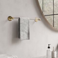 a towel rack with two towels hanging on it