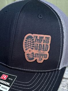 "\"I'm not a Step Dad I'm a dad who stepped up\" Hat - what more is there to say? We also make and sell full custom Patch hats. Wooden patches, leather patches, cork patches, etc. Please see our other listings to place a custom order with your logo or another desired graphic! This is a Dad Bod Patch Hat.  Stand out with a high-quality patch adding your business logo or image engraved. We do wood patches, leatherette patches, cork patches, etc.  PRODUCT DETAILS -------------------------- ~ Richardson 112 trucker style snapback hats ~ Add your logo on our high quality custom made hats. ~ Please get in touch with us or view other listings to order bulk orders of 5+ hats!  HOW TO ORDER ----------------------- 1. Select hat color from the drop-down. All colors/styles are shown in a photo in our Casual Outdoor Baseball Cap For Father's Day, Custom Made Hats, Patch Hats, Custom Patch, Hat Stand, Step Father, Patch Hat, Dad Bod, Hat Patches