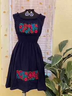 "Beautiful Floral Embroidered Elastic Loose Fit Dress - In some dresses the embroidery design is Handmade & in some others is machine Embroidered Mexican Dress - Artisan Made Dress This has been made and brought directly from Puebla, Mexico. The dress has extremely detailed embroidery.  All the work on this dress has a professional skilled finish and the multicolor embroidered makes it look even more eye catching. The embroidery work is made with great quality thread. The eye catching will be on Traditional Sleeveless Dress With Floral Embroidery, Traditional Sleeveless Embroidered Fiesta Dress, Traditional Sleeveless Embroidered Dress For Fiesta, Sleeveless Folk Embroidered Dress With Floral Embroidery, Folk Style Sleeveless Dress With Multicolor Embroidery, Fitted Embroidered Dress With Multicolor Embroidery, Sleeveless Dress With Multicolor Embroidery And Embroidered Hem, Traditional Multicolor Dress With Machine Embroidery, Fitted Dress With Multicolor Embroidery And Embroidered Border