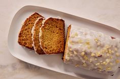 a white plate topped with slices of cake