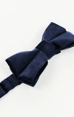 There's a luxurious quality to velvet that makes it an ideal fabric for bow ties. You can add a velvet accent to your formal attire by wearing this navy bow tie with a navy or midnight blue tuxedo, or go all-out opulent by adding the matching navy velvet waistcoat and navy velvet blazer, both available separately. Midnight Blue Tuxedo, Velvet Waistcoat, Navy Bow Tie, Black Tie Tuxedo, Tweed Wedding, Boys Waistcoat, Blue Tuxedo, Tweed Overcoat, Harris Tweed Jacket