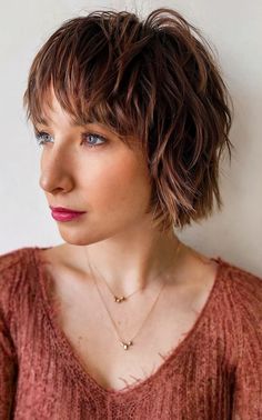 Razor-cut shaggy bob with curtain bangs, adding texture and volume for a modern look Shaggy Bob With Curtain Bangs, Shaggy Short Bob, Choppy Bob Hairstyles With Bangs, Short Shaggy Hairstyles